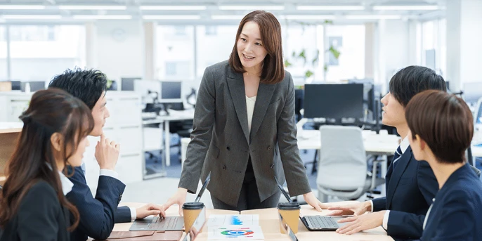 Diverse business team meeting — social responsibility and employee wellbeing
